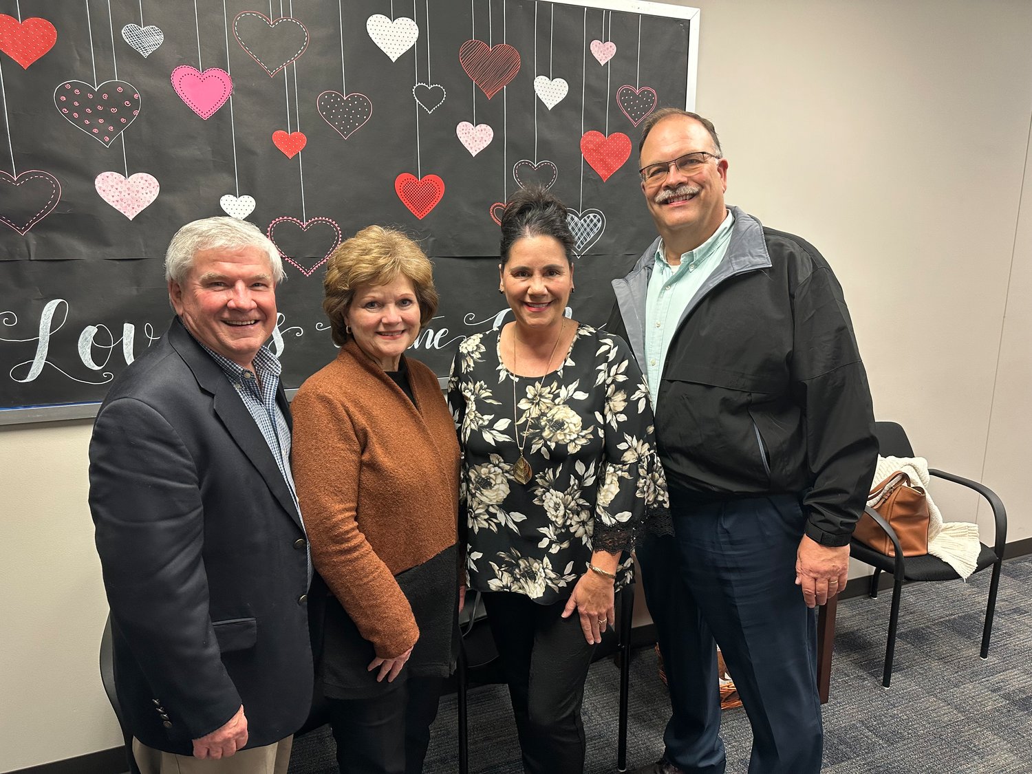 David and Terri Youngblood visit with Cindie and Russell Faldyn after Katy school trustees named the district’s newest elementary schools in their honor Monday.